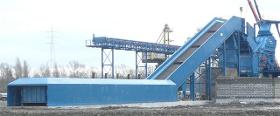 INFEED CONVEYORS FOR SCRAP AND SOLID WASTE SYSTEMS
