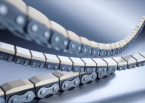 Roller chain with vulcanised elastomer profiles